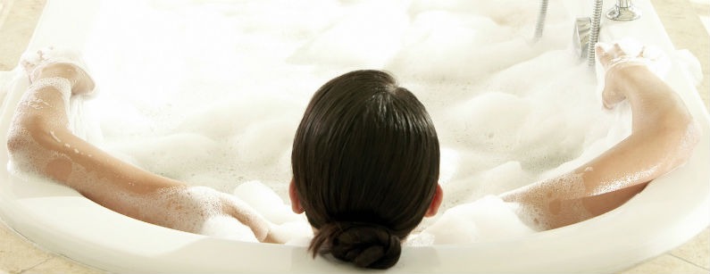 woman relaxing in bathtub